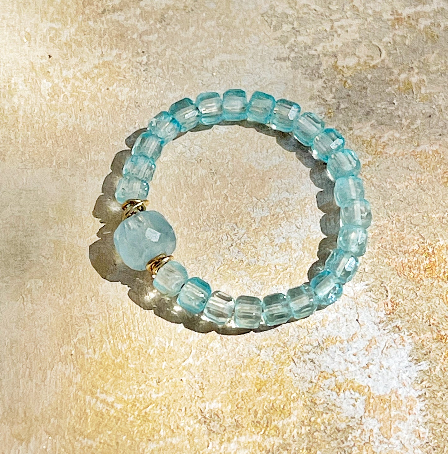 Delicate blue topaz and aquamarine ring