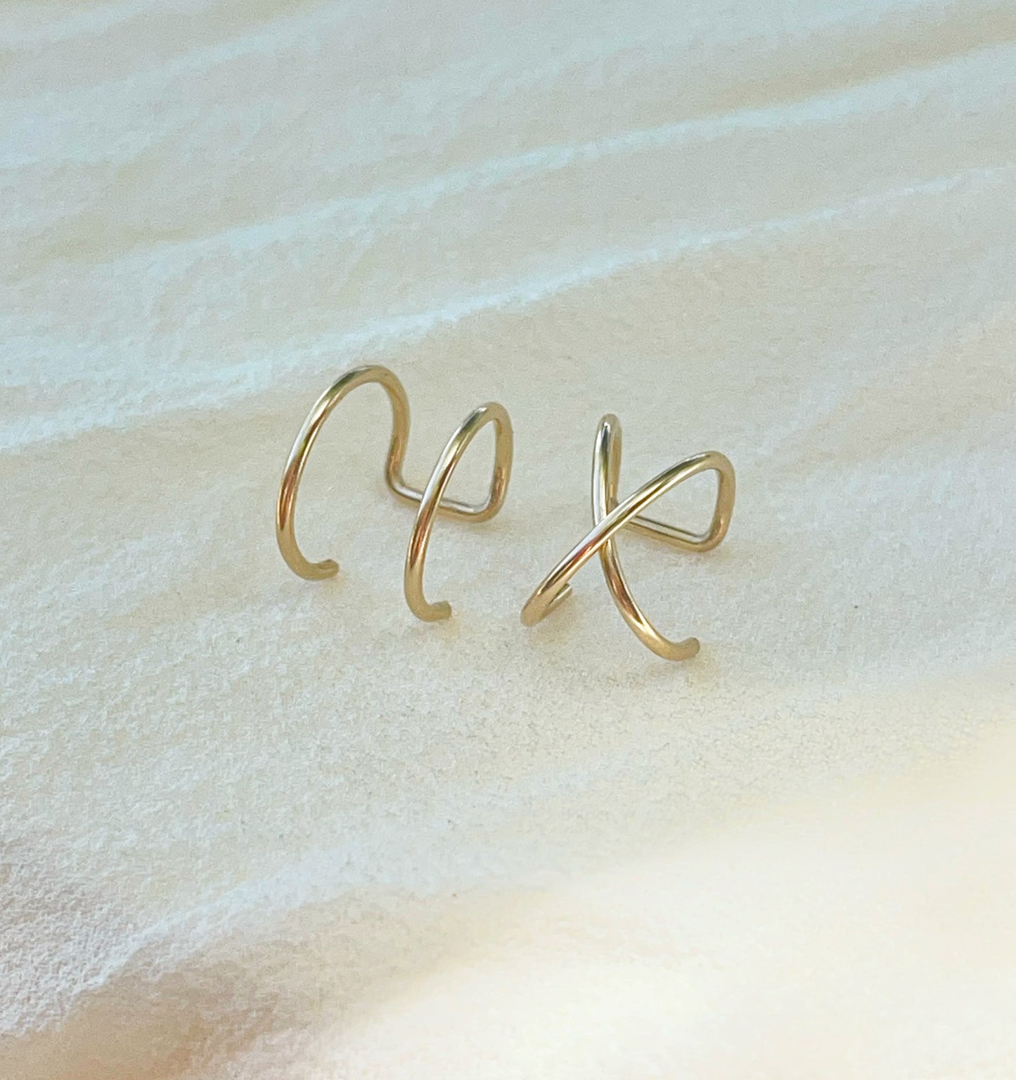 A pair of minimalist caps