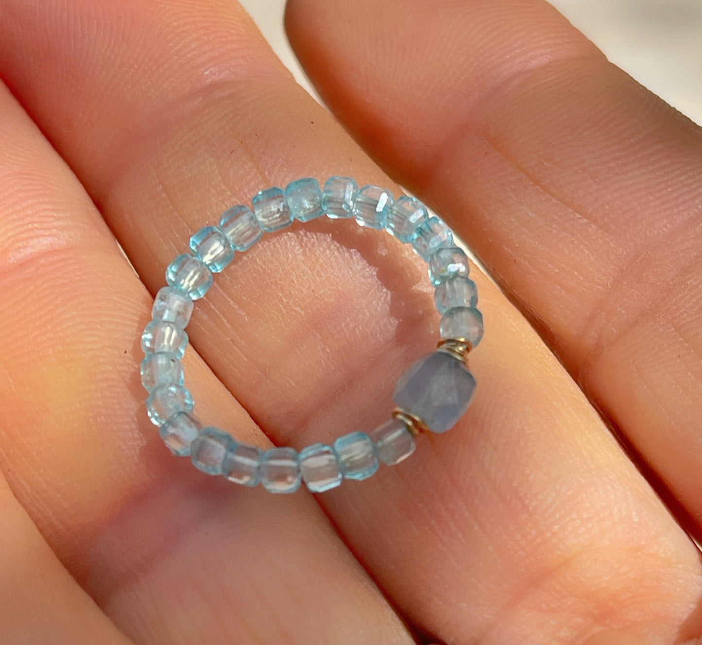 Delicate blue topaz and aquamarine ring