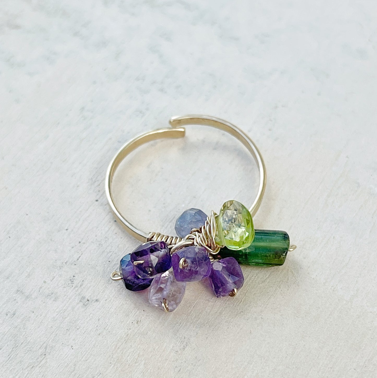 Open ring with gemstone pendant