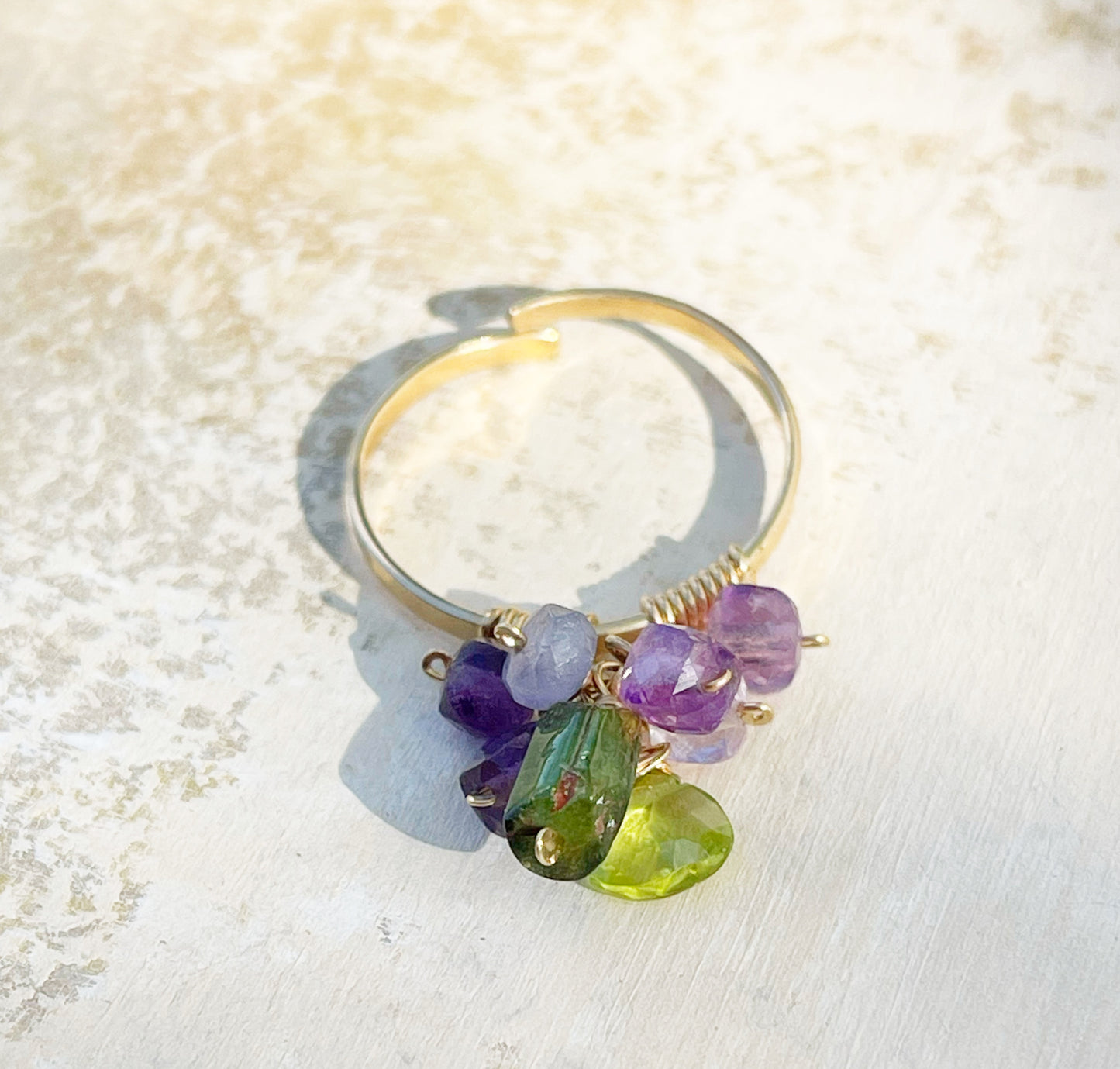 Open ring with gemstone pendant