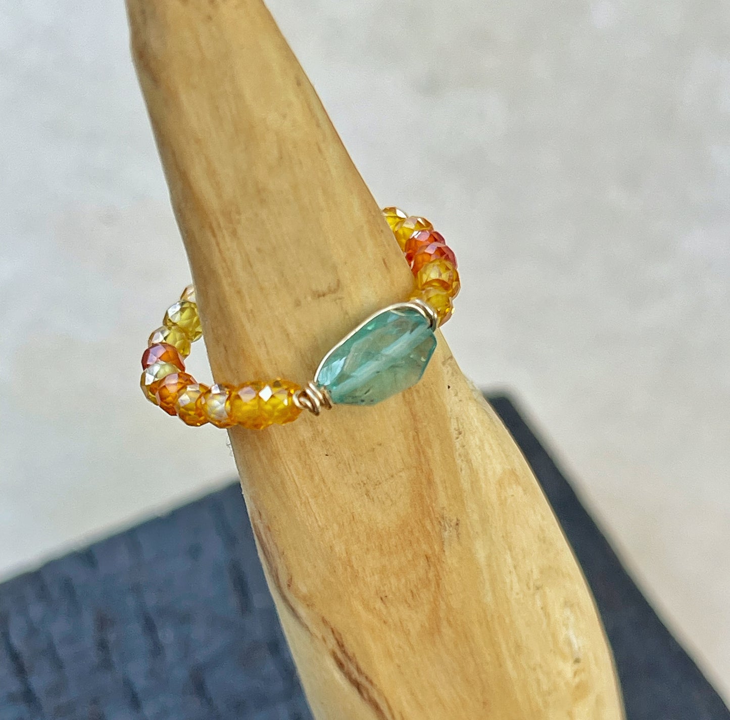 Delicate ring with colored zircon and natural apatite