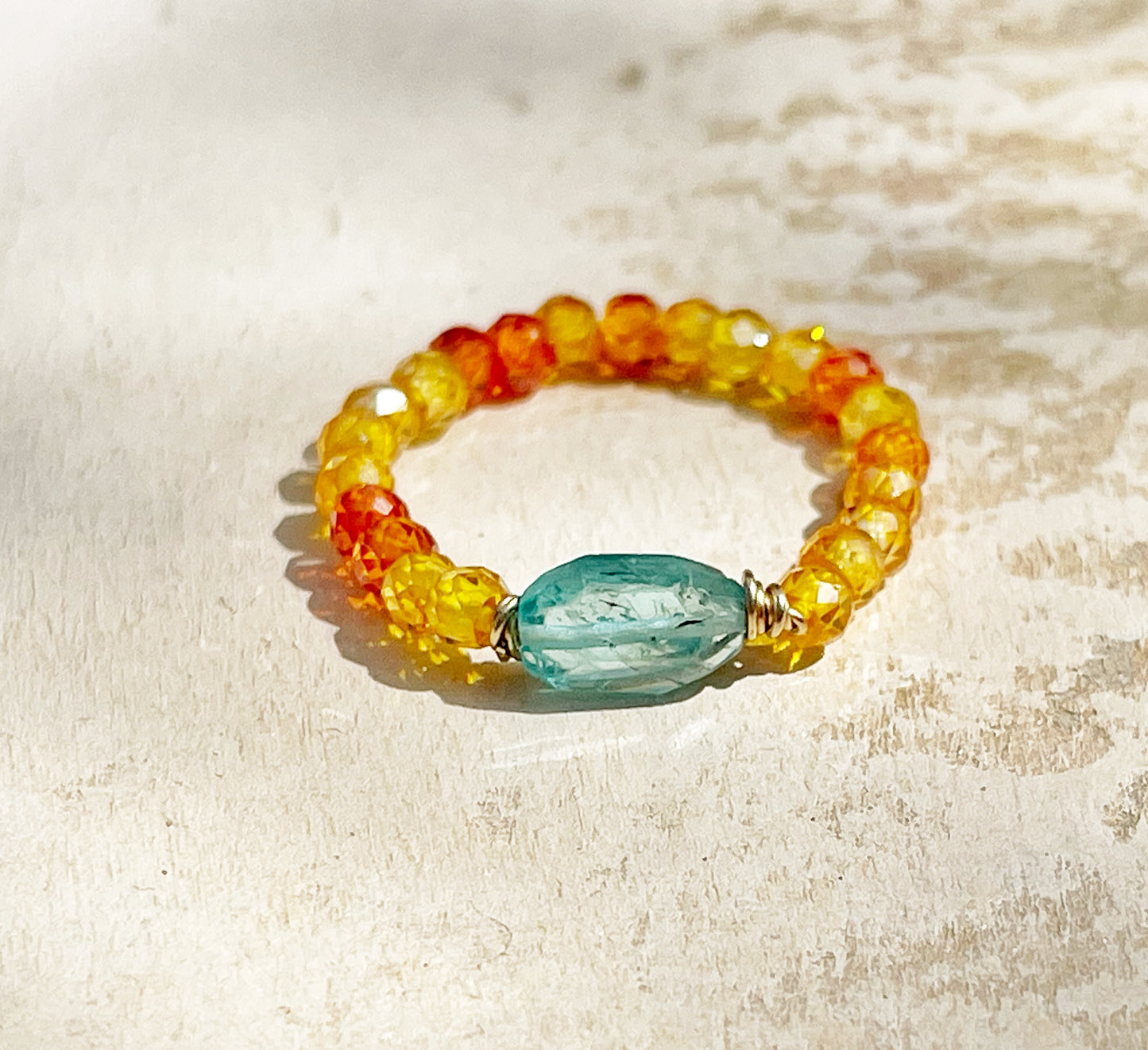 Delicate ring with colored zircon and natural apatite