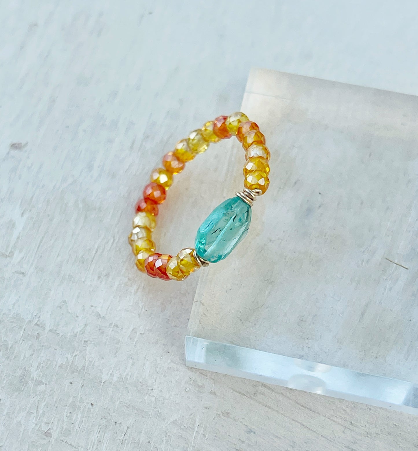 Delicate ring with colored zircon and natural apatite