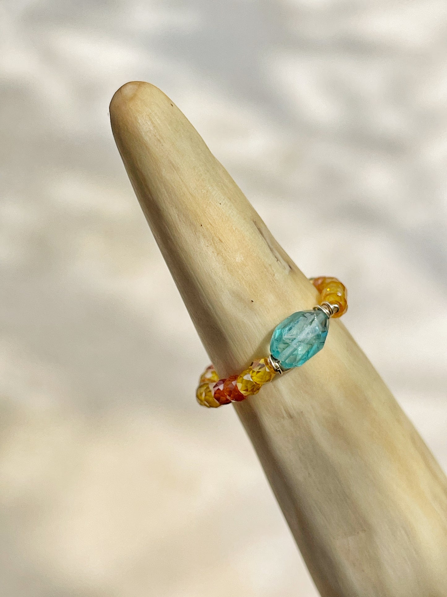 Delicate ring with colored zircon and natural apatite